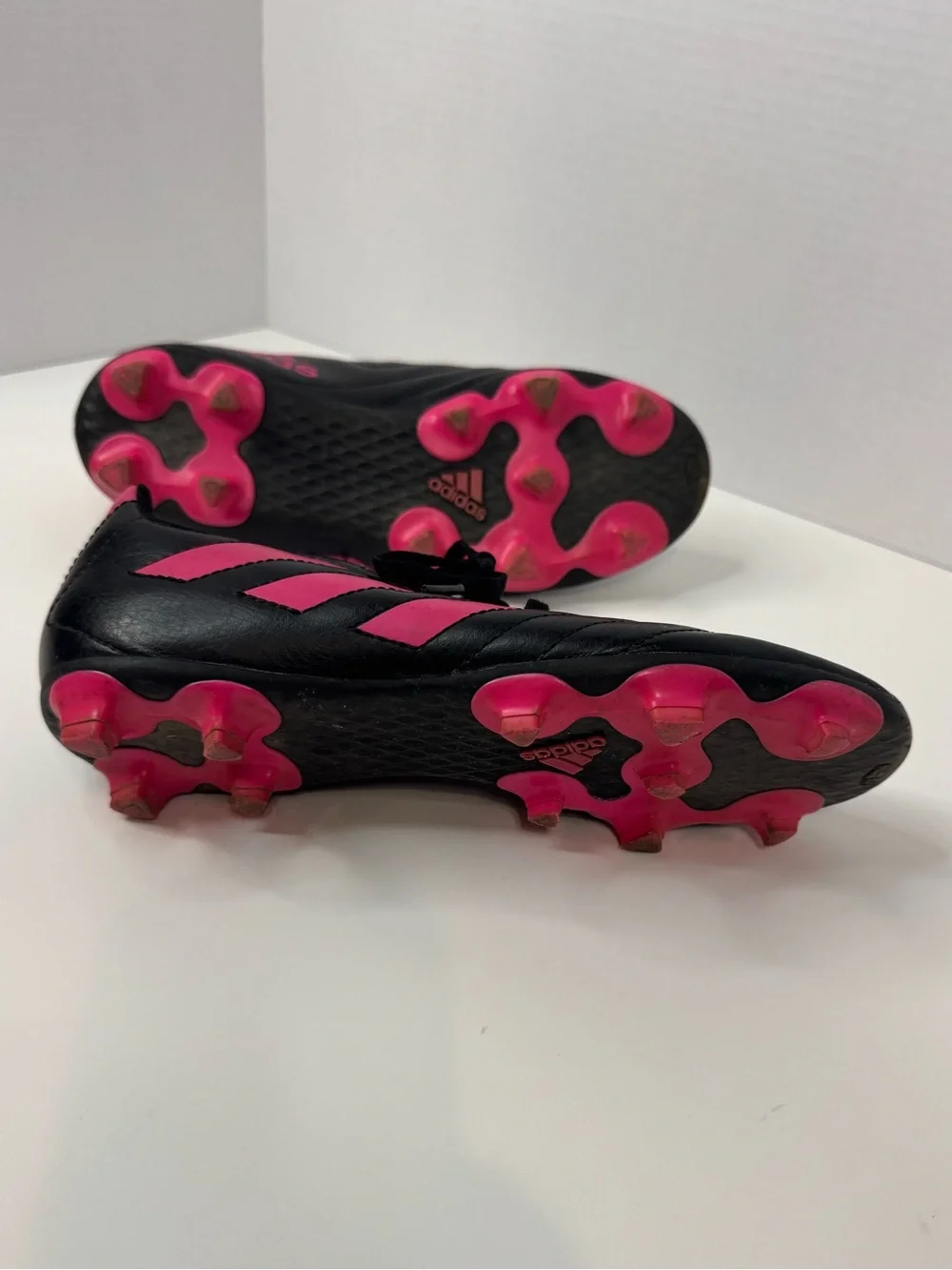 adidas Kids Black Soccer Cleats with Pink Stripes and Spikes